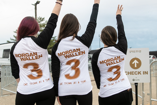 Fans attending Morgan Wallen concert wearing shirts with the number three on them