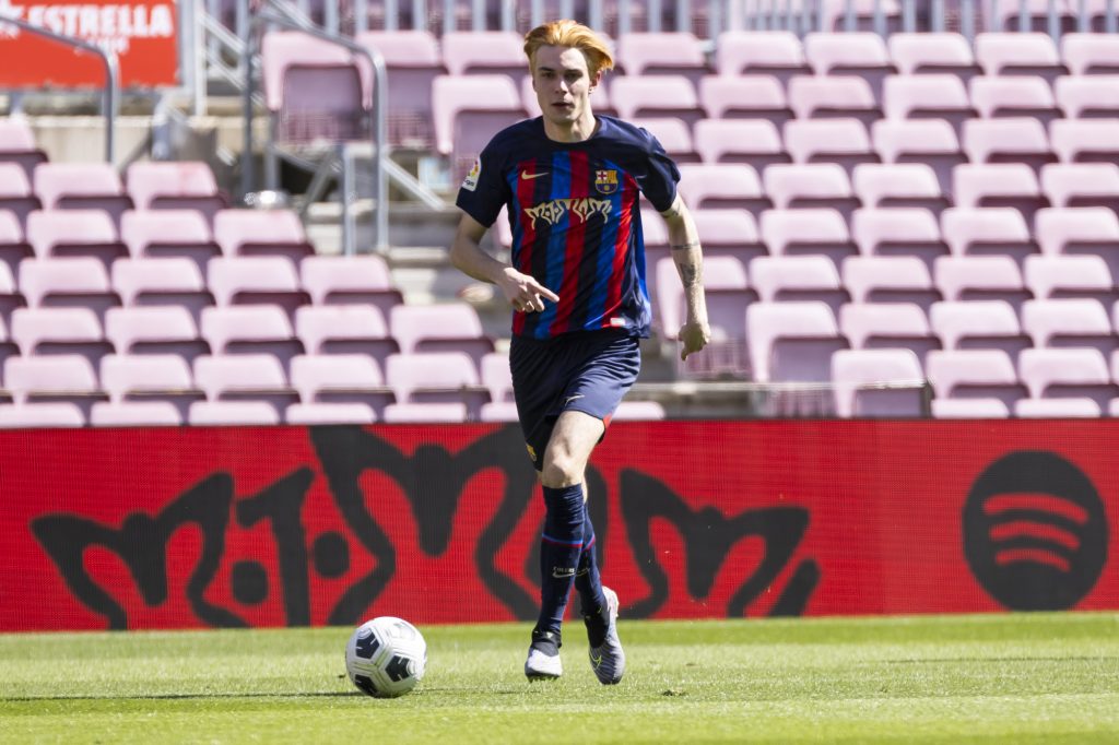 a man is dribbling the ball down the field