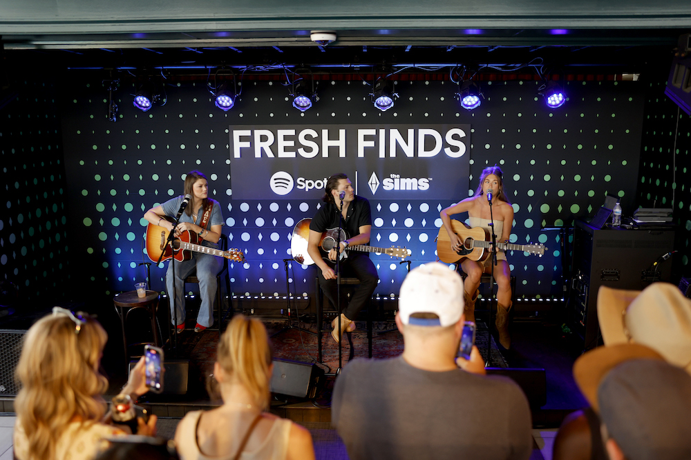 Mae Estes, Logan Crosby and Lauren Watkins perform on the Fresh Finds Rooftop at Spotify House during CMA Fest 2023