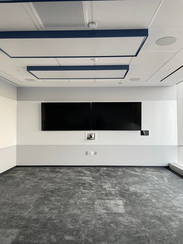 a plain empty conference room with white calls