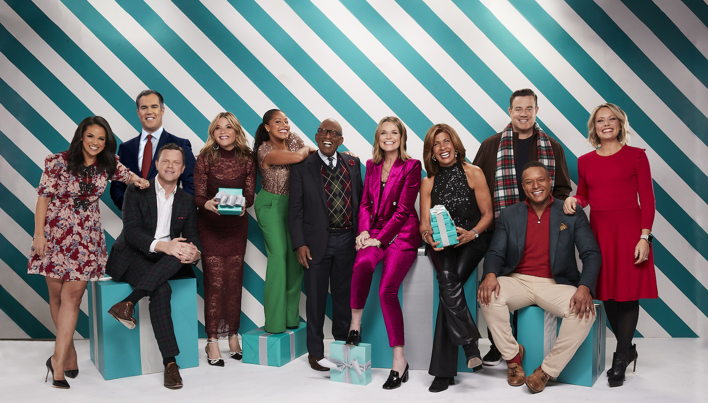 the TODAY show anchors standing in front of a green and white backdrop