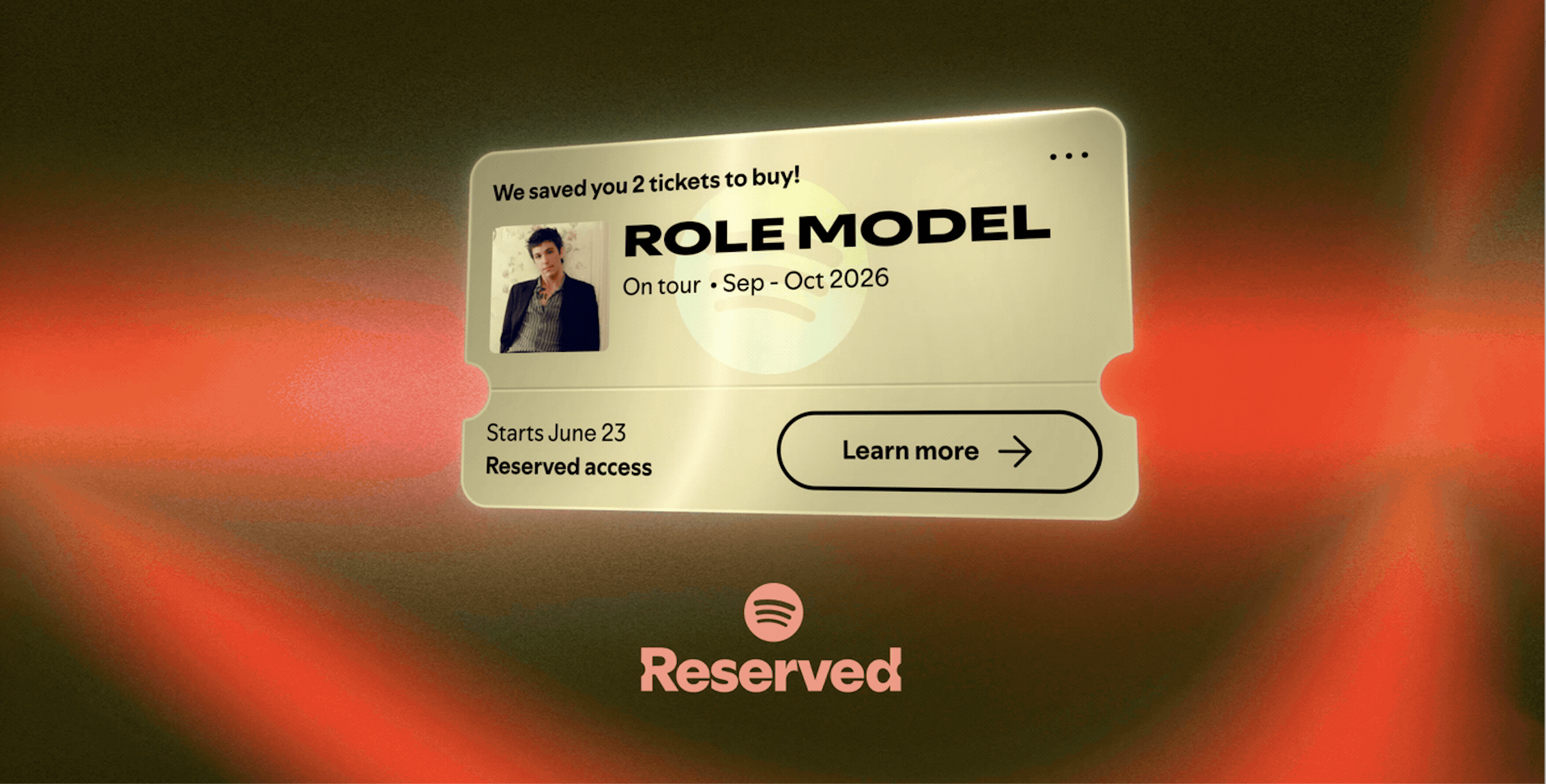A golden ticket appearing in front of a red, curtain-like backgorund