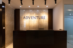Entrance on the Top Floor (18F) - The ADVENTURE logo exudes a distinctive presence