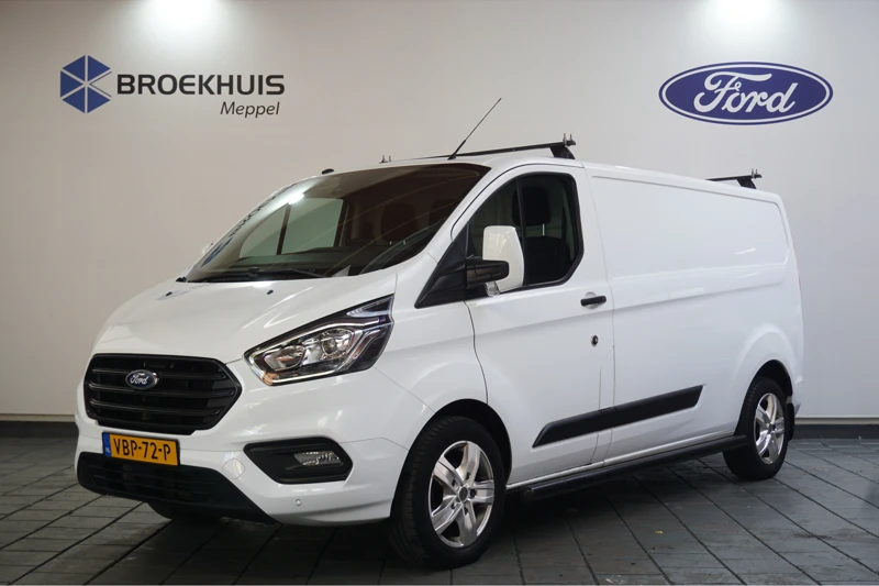 Ford Transit Custom 300 2.0TDCI L2H1 Trend | Navi | Groot scherm | Camera | Trekhaak | Dakdragers | LMV | Sidebars | Voorruitverwarming | Cruise Con