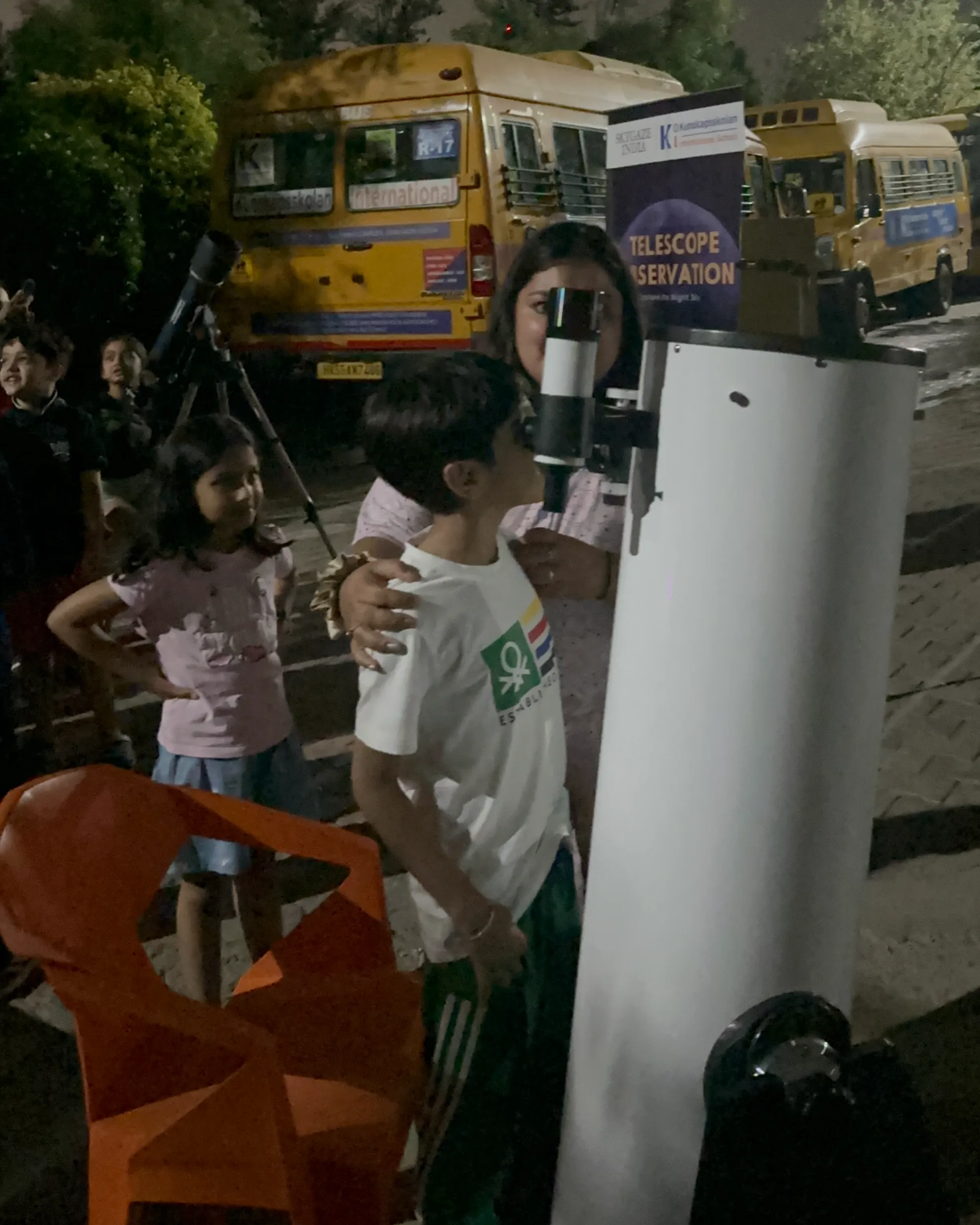 Student watching through Dobsonian Telescope