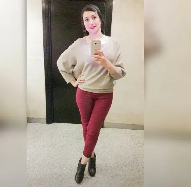 Woman Taking Mirror Selfie Indoors