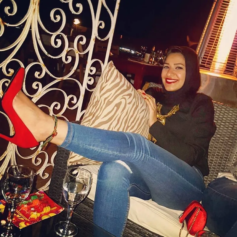 Woman Reclining in Restaurant Lounge