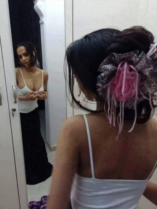 Woman Reflected In Dressing Mirror
