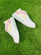 Stylish light green coloured sneakers for girls