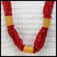 Maroon Beads Enclosed Woven Pote