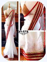 Beautiful White Saree with Red Border