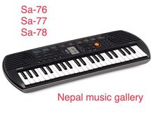 Casio SA-77 EMI-Keyboard Mini With Free Adapter - Black/White