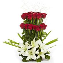 20 red roses and 2 lillies with a basket