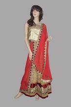 Golden machine embroidered lehnega with maroon color border.