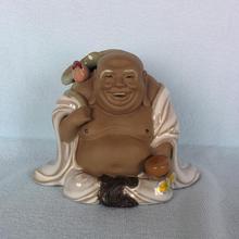 Laughing Buddha with Leaf (Statue)
