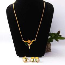 Gold Plated Faux Moti And Stone Embellished Necklace, Ear Studs And Ring Set For Women