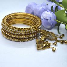 Golden Textured White Stone Studded Bell Fall Bangles Set For Women- 4 Bangles Set