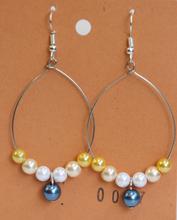 Large hoop pearl earring