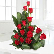 15 red roses in a basket