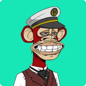 An illustration of a red-furred ape wearing a captain's hat, grimacing with half-lidded eyes, and wearing a dress shirt and maroon vest with an ascot