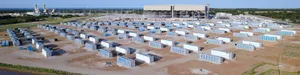 Aerial photo of dozens of containers housing crypto mining infrastructure on a large plot of land