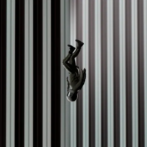 A rendering resembling the famous "The Falling Man" photo. A man in an astronaut suit falls headfirst, with a striped background resembling a tall office tower.