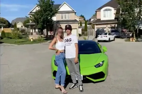 Aidan Pleterski and a woman with her face blurred stand in front of a lime green Lamborghini in what appears to be an upscale suburb