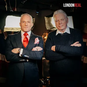 Brian Rose and David Icke pose next to one another with their arms crossed