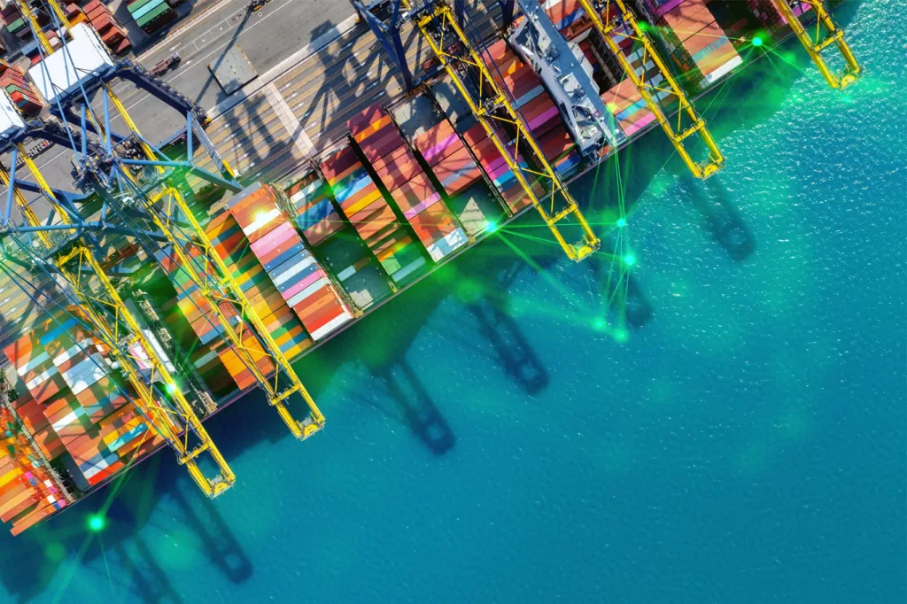 aerial view of cargo ship on water with green plexus overlayed