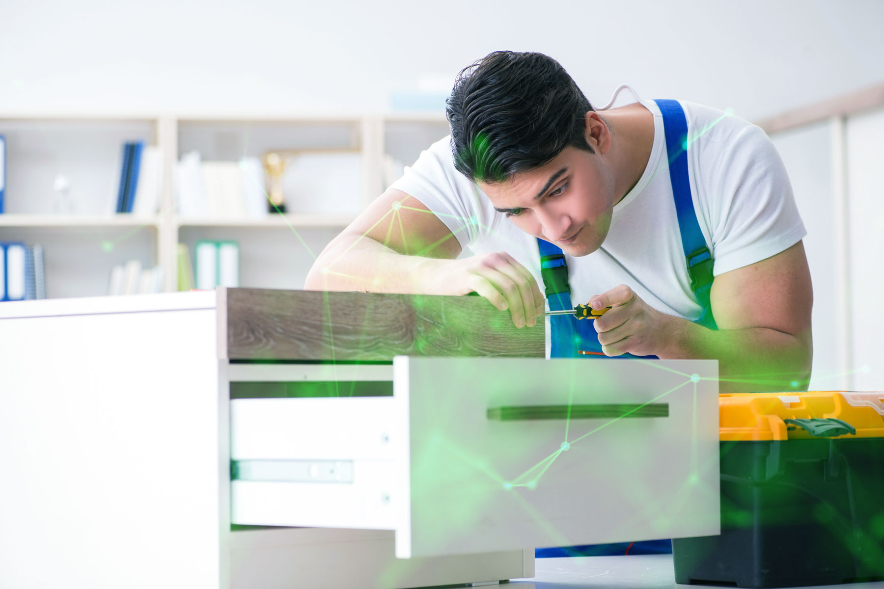 man assembling furniture with green plexus overlayed