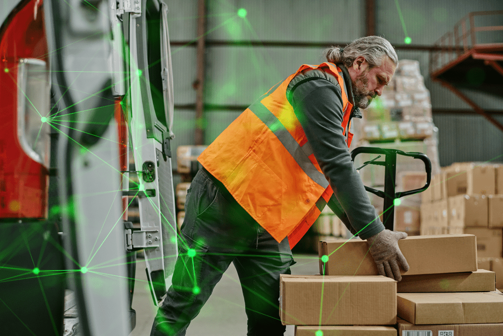 worker loading van in warehouse wearing hi-vis with a green plexus overlayed