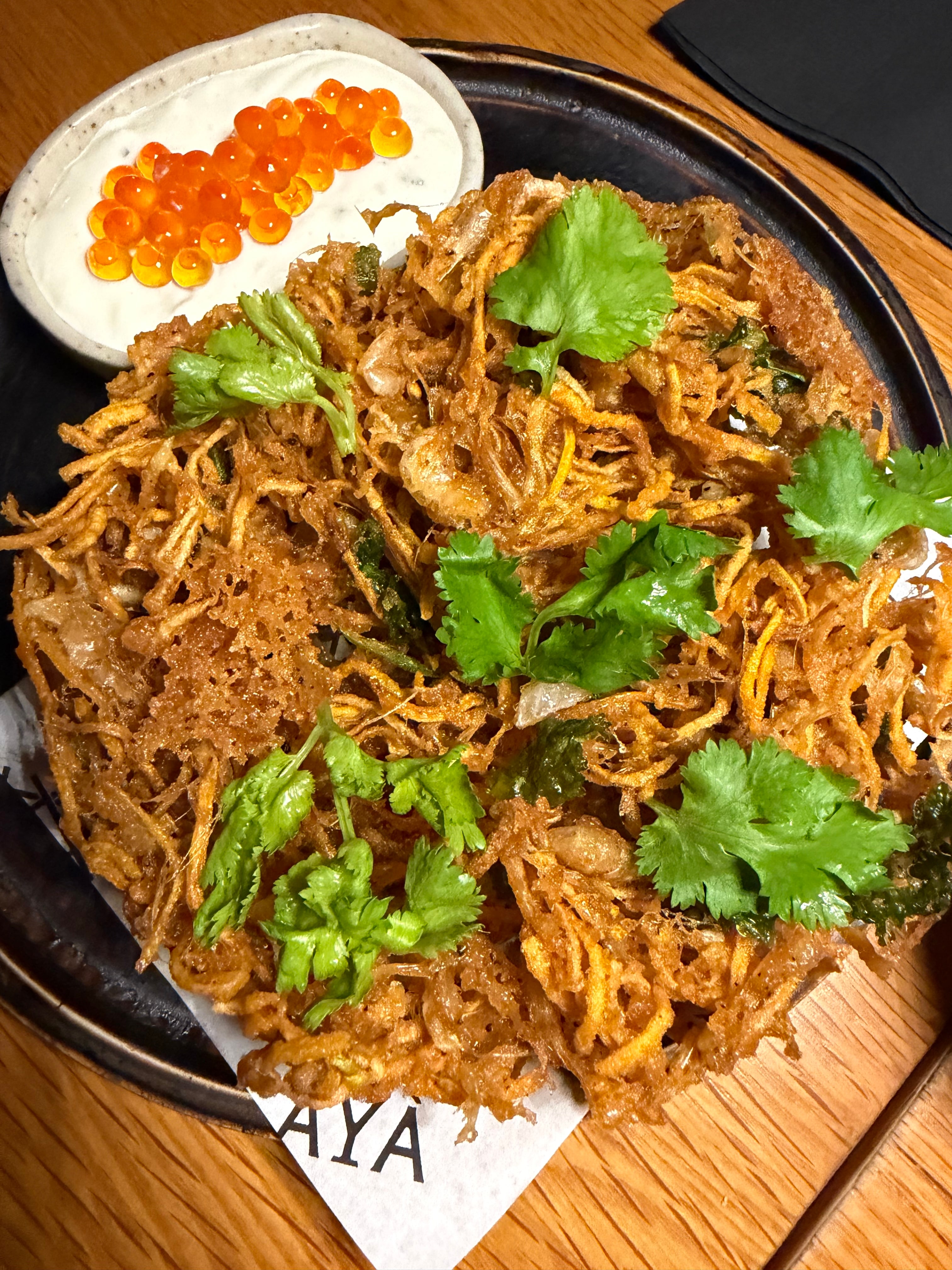 Okoy, and Pearls, a a modern take on Filipino okoy, featuring Tagunton baby shrimp and vegetable fritters paired with pinakurat sour cream, chives, and ikura.