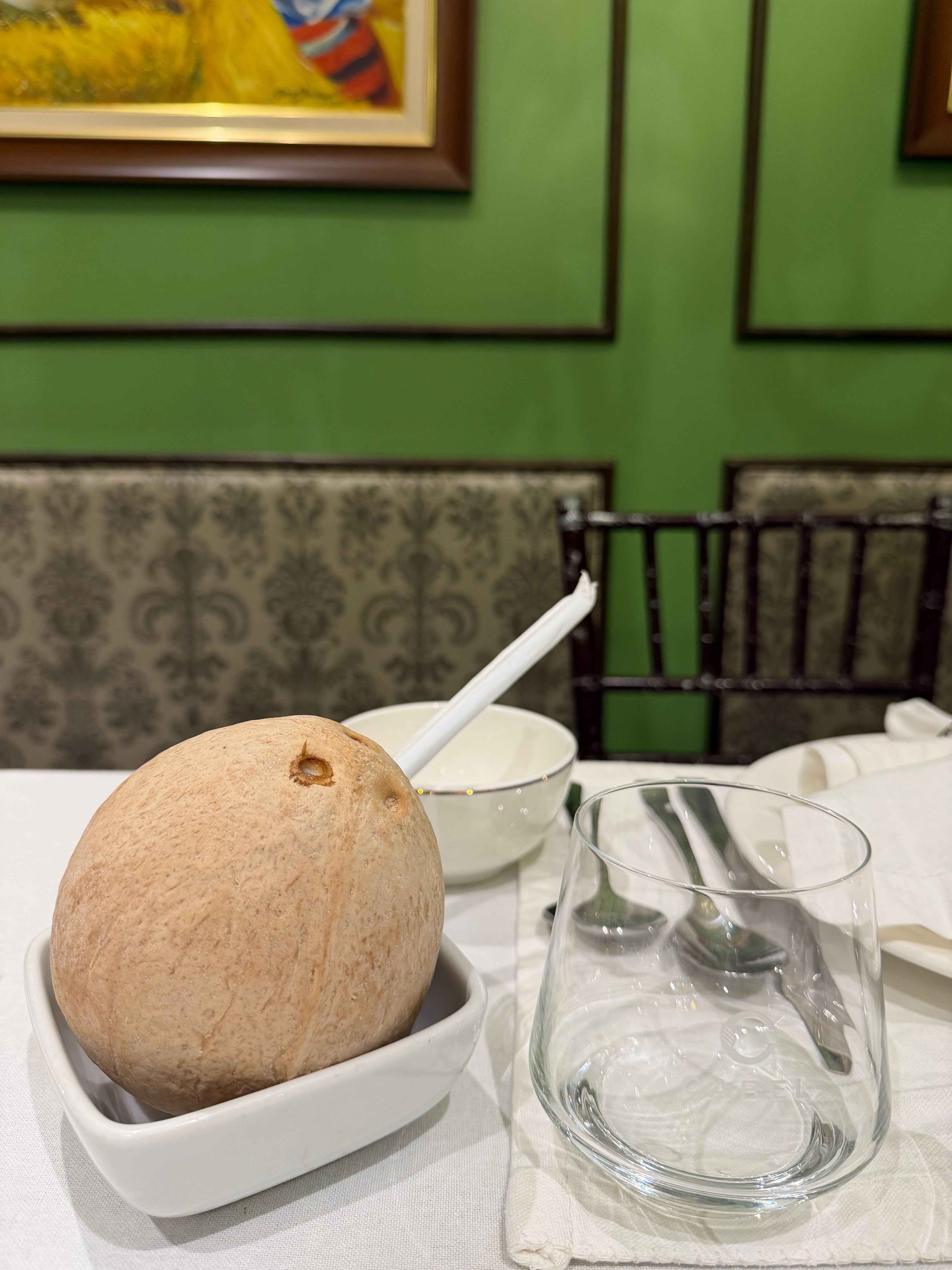 Fresh Buko in the Shell, refreshing young coconut served in its natural shell, a simple and quintessentially Filipino way to enjoy a cool tropical drink.
