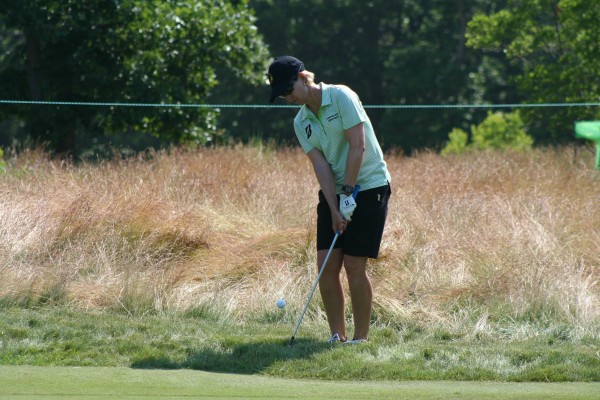 Karrie Webb practices from greenside rough