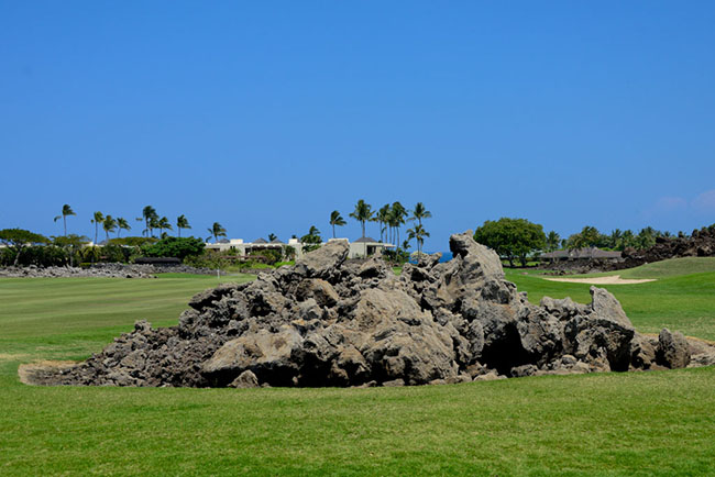 Lava mound sit in the middle of the fairways on several holes. Photo by Matt Kartozian.