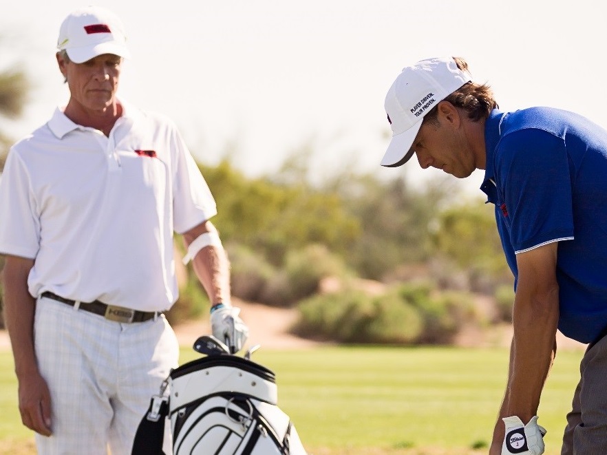 Kim, working with a player