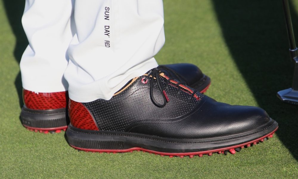 Spotted: Tiger Woods in Sun Day Red shoes, apparel at Genesis