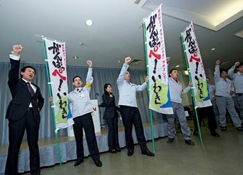 Carlos Ghosn, fourth from left, shouts words of  encouragement to employees at Nissan's  quake-hit Iwaki plant, in Fukushima Prefecture.