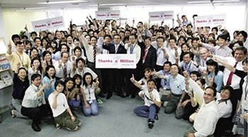 Carlos Ghosn and Nissan Motor employees celebrate addition of 1 million vehicles.