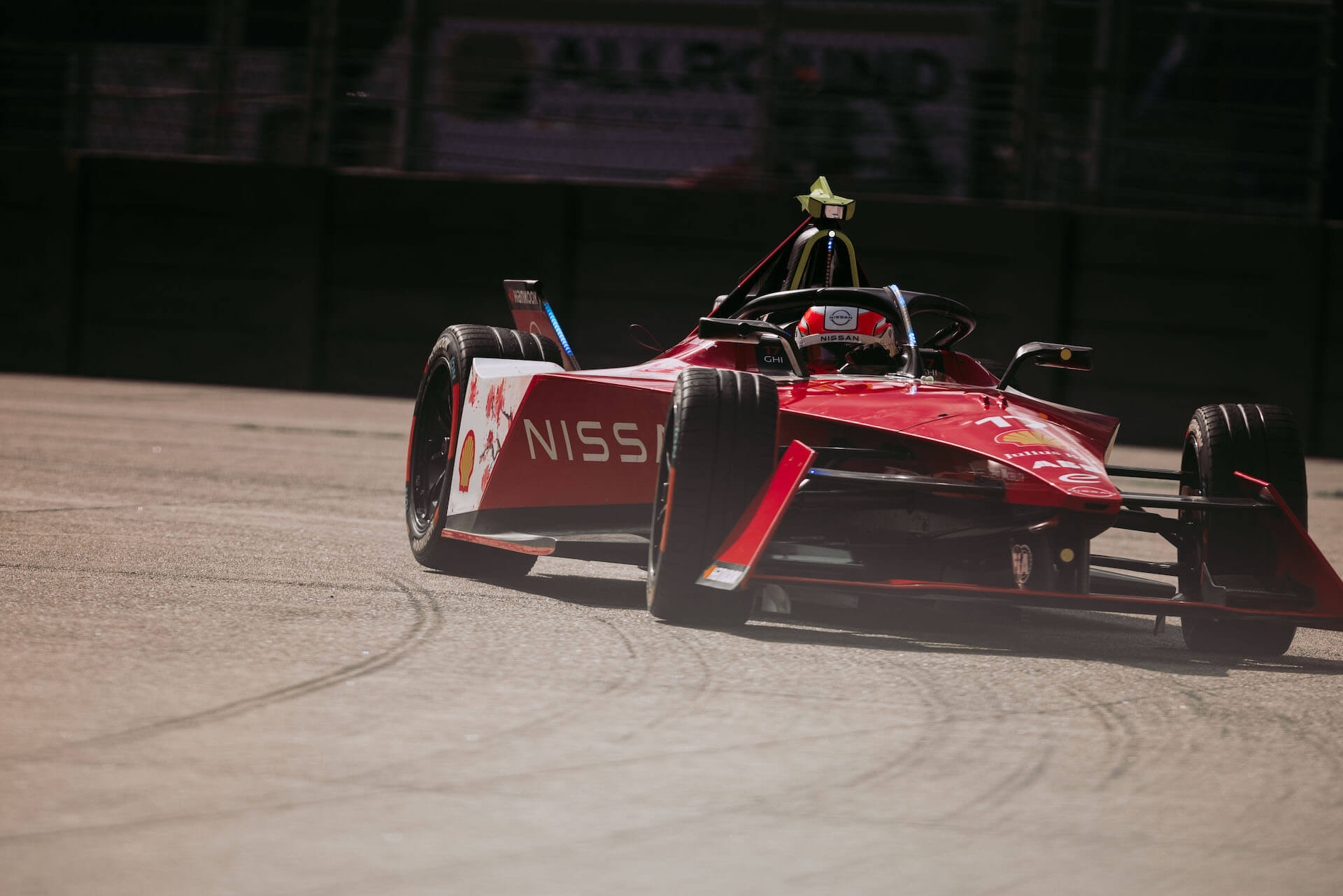 Nissan Formula E Racer accelerates out of pit area