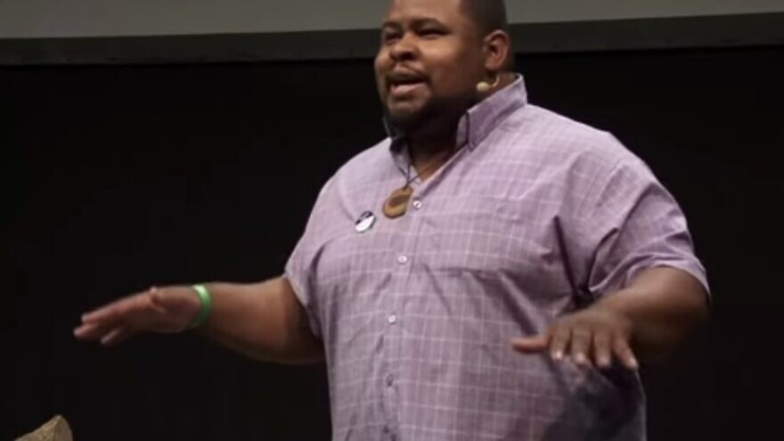 <p>Michael W. Twitty speaks in front of an audience. Twitty spoke that he wouldn't forgive Ye, formerly known as Kanye West, for his antisemitism. WIKIMEDIA COMMONS/JNS</p>