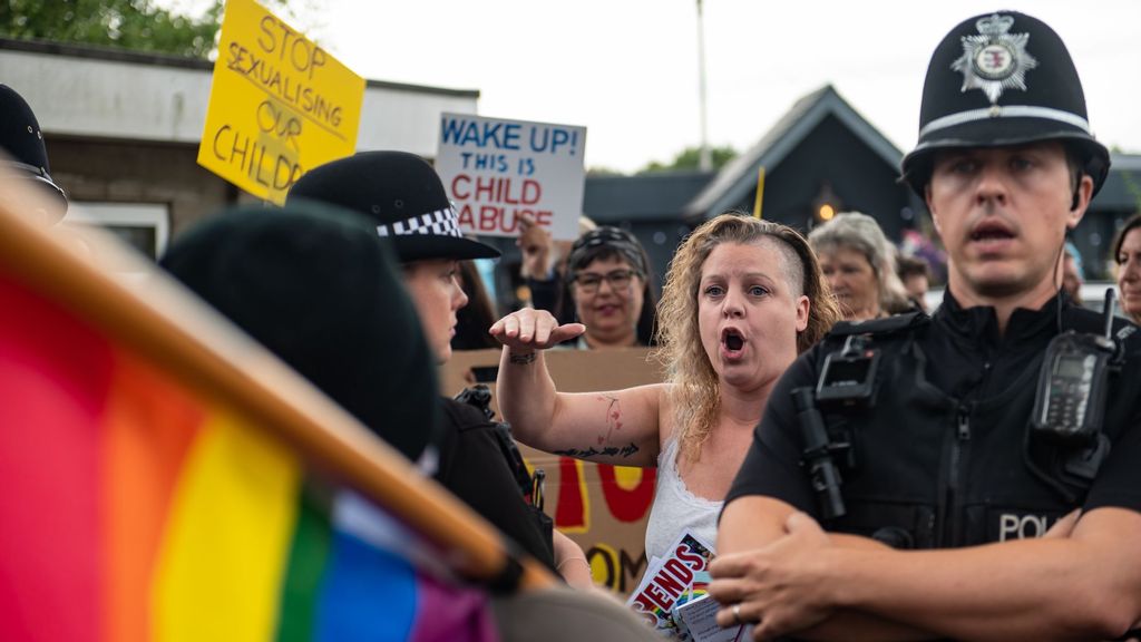 Protesters and counter-protesters clash over library drag queen hour for kids