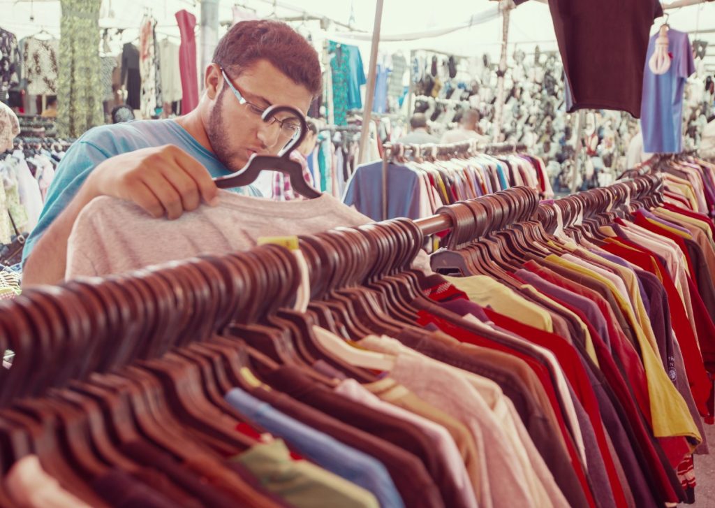 A customer shopping for clothes at a store. Most of the items within the average American household arrived there secondhand, new research suggests. ESB PROFESSIONAL/SWNS TALKER