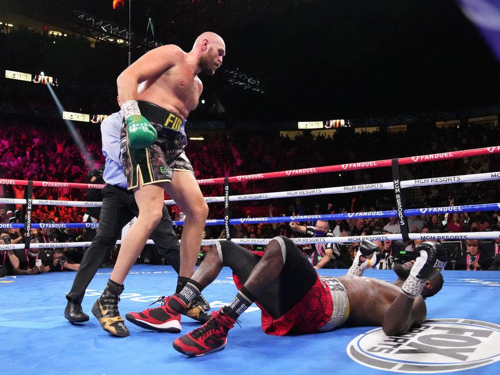 Fury stands over Wilder after knockdown