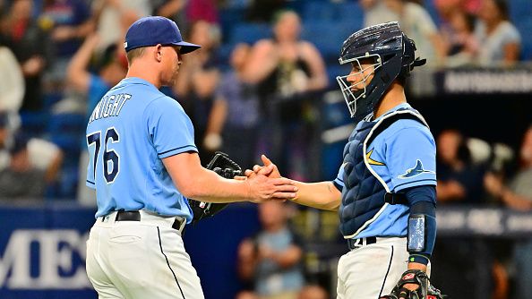 PItcher Dusten Knight #76 and catcher Francisco Mejia #21 of the Tampa Bay Rays celebrate a 10-5 win over the Toronto Blue Jays at Tropicana Field on September 22, 2022 in St Petersburg, Florida. (Photo by Julio Aguilar/Getty Images)