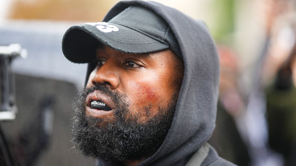 Kanye West aka Ye is seen wearing a Balenciaga boxing mouthguard, outside Givenchy, during Paris Fashion Week - Womenswear Spring/Summer 2023 - Day Seven on October 02, 2022 in Paris, France. (Photo by Edward Berthelot/GC Images)