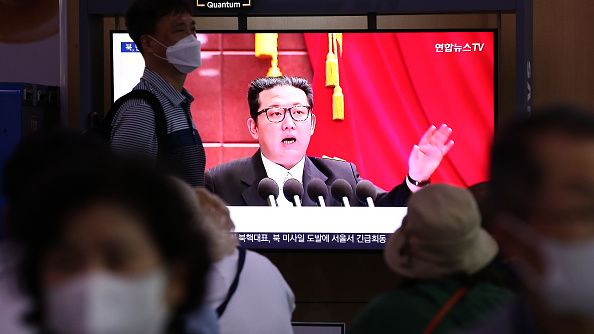 People watch a television broadcast showing a file image of a North Korean leader Kim Jong-Un in Seoul, South Korea, June 05, 2022. A day after South Korea and the United States wrapped up their joint drills near the peninsula. (CHUNG SUNG-JUN/GETTY IMAGES)