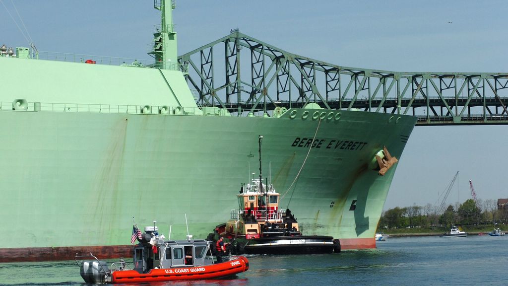 FILE - A U.S. Coast Guard boat helps the Liquified Natural Gas container ship Berge Everett as it comes inbound May 8, 2006 in Boston, Massachusetts. (Photo by Kelly Turner/U.S. Coast Guard via Getty Images)