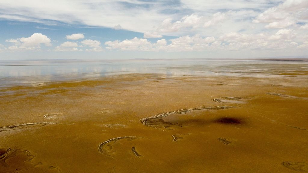 Aerial view of a muddy plain at the site of former Lake Poopo, near Punaca Tinta Maria, Bolivia, taken on October 15, 2022. - Lake Poopo, once Bolivia's second-largest, has largely disappeared, taking with it a centuries-old culture reliant entirely on its bounty. PHOTO BY MARTIN SILVA/AFP VIA GETTY IMAGES