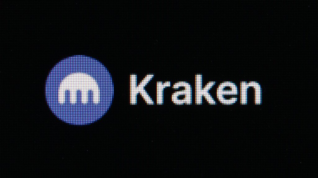 The logo of the crypto exchange Kraken can be seen on the screen of a computer in an office. Kraken was fined by the Department of Treasury for violation of sanctions allowing crypto transactions in Iran. PICTURE ALLIANCE/BENZINGA